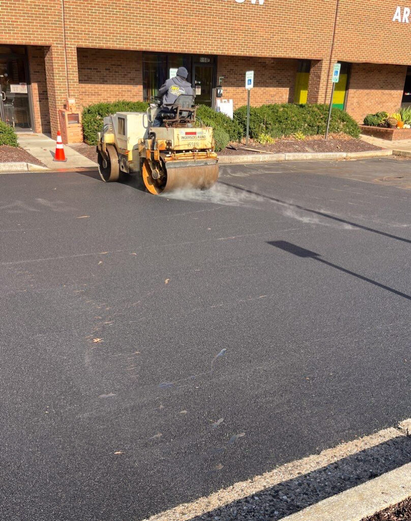 Crew applying asphalt for commercial parking lot in Hanover MD