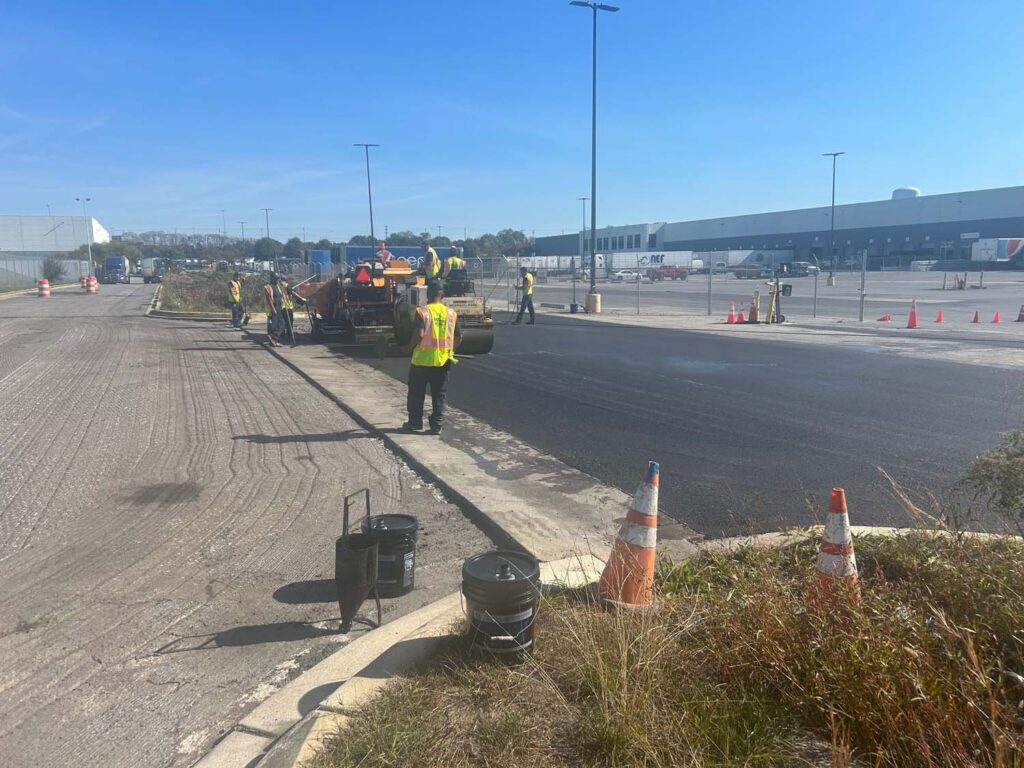 Crew applying asphalt for commercial parking lot in Hanover MD